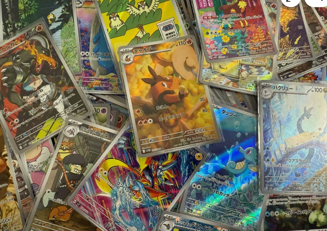 Japanese Pokémon Art Rare Card Bundle featuring 15 to 100 collectible Pokémon cards by KTM Collectibles, with unique Japanese artwork.