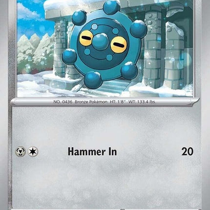 Pokémon Prismatic Evolutions Bronzor card, featuring a metallic gray Pokémon with intricate designs on a colorful background.